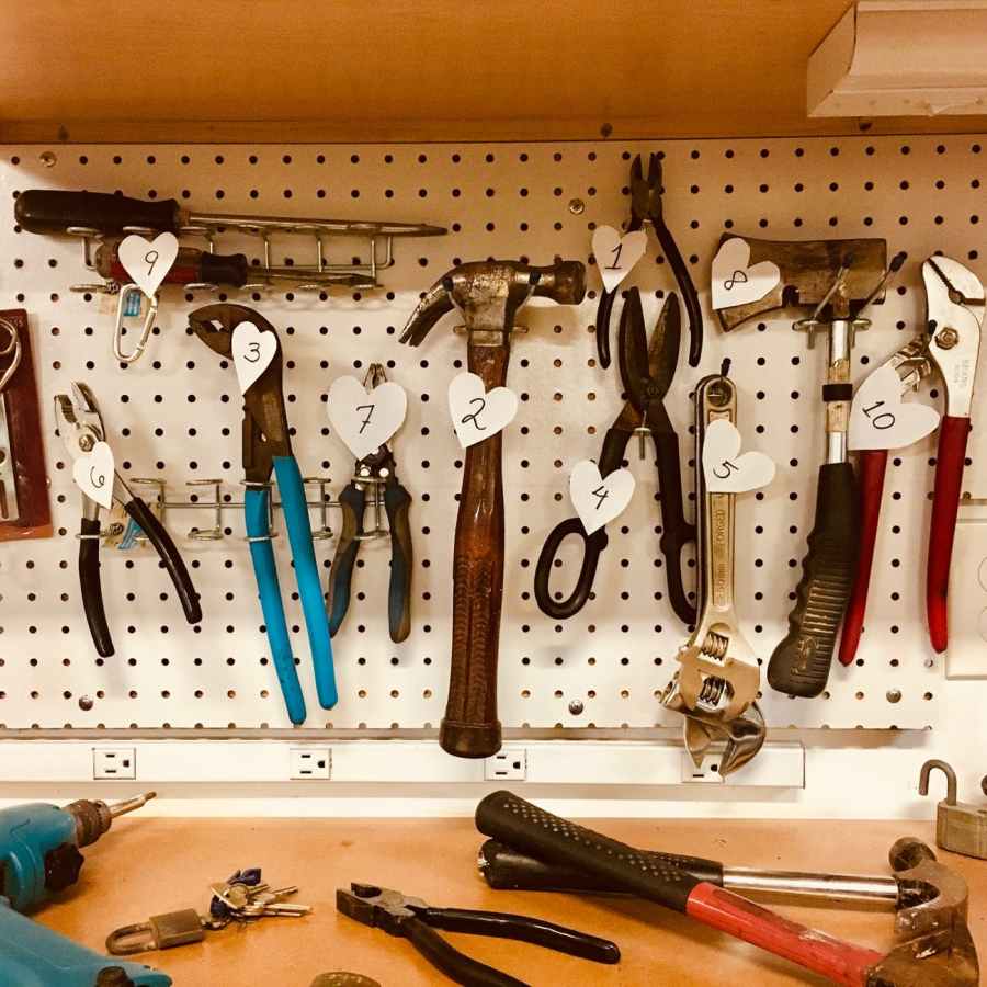 handheld tools hang on workbench